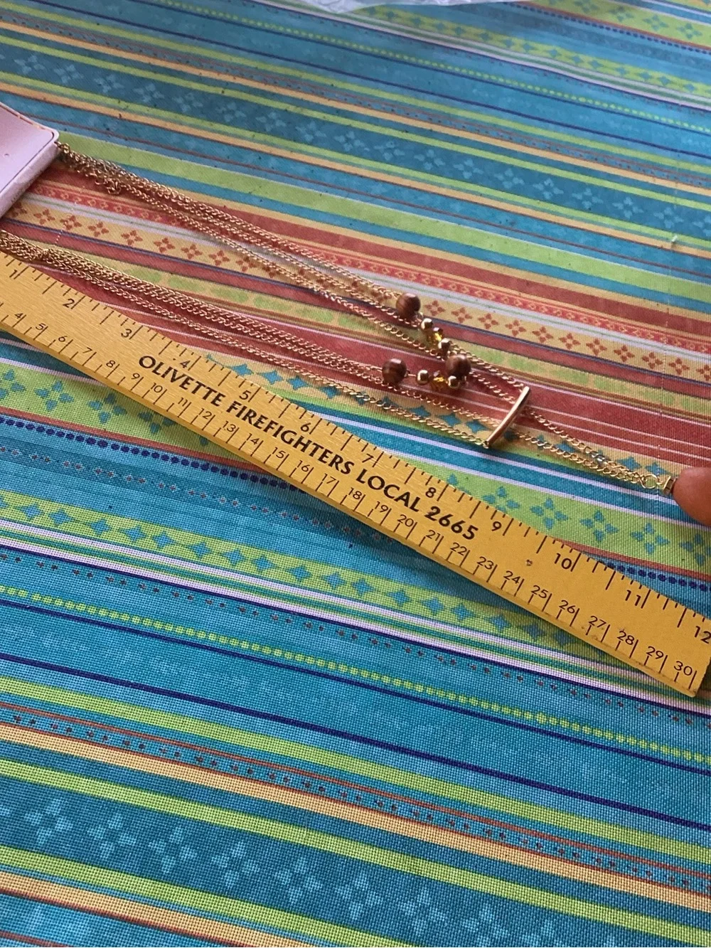 Superstar Accessories Necklace with wood, tassel and gold tone accents